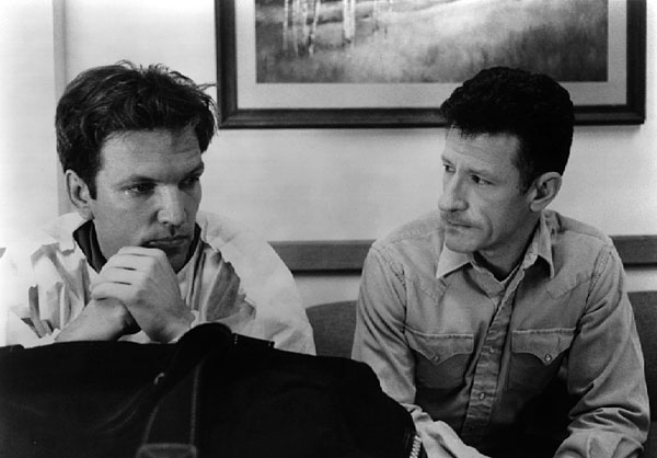 Lyle Lovett as Sheriff Carl Tippett and Martin Donovan as Bill